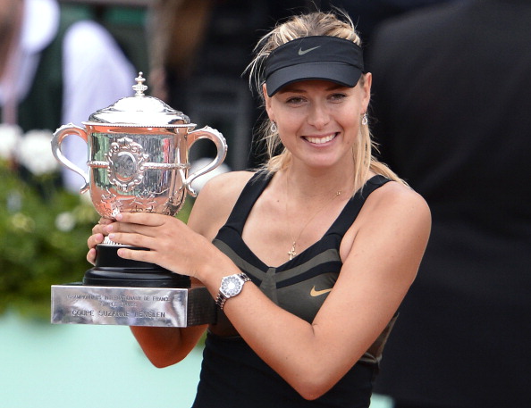 Russia's Maria Sharapova holds a trophy